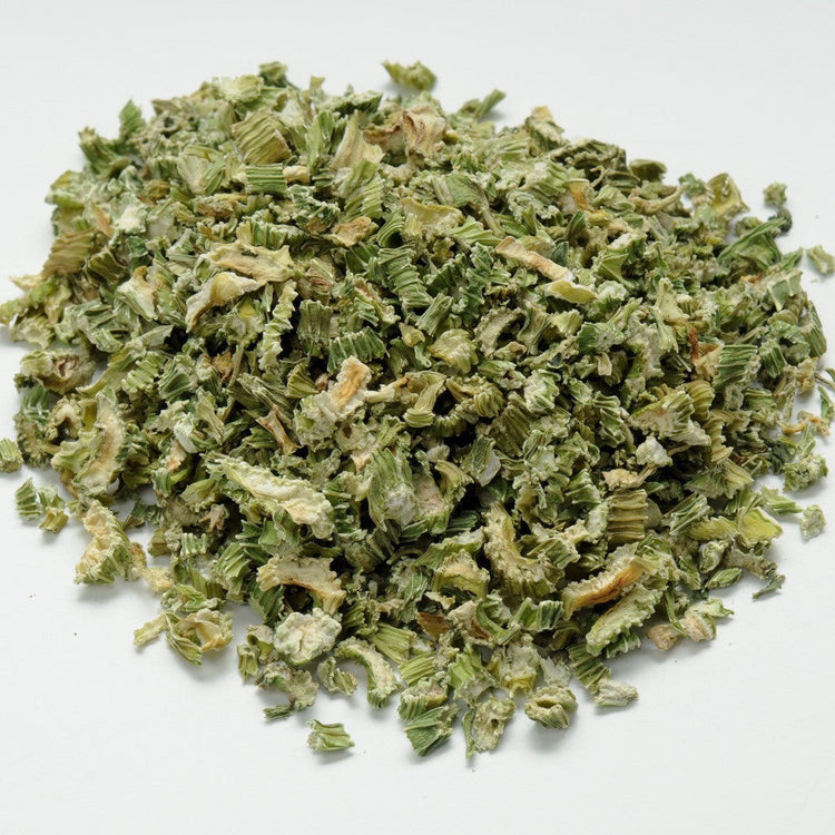 Dried green herbs on a white background
