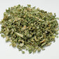 Dried green herbs on a white background