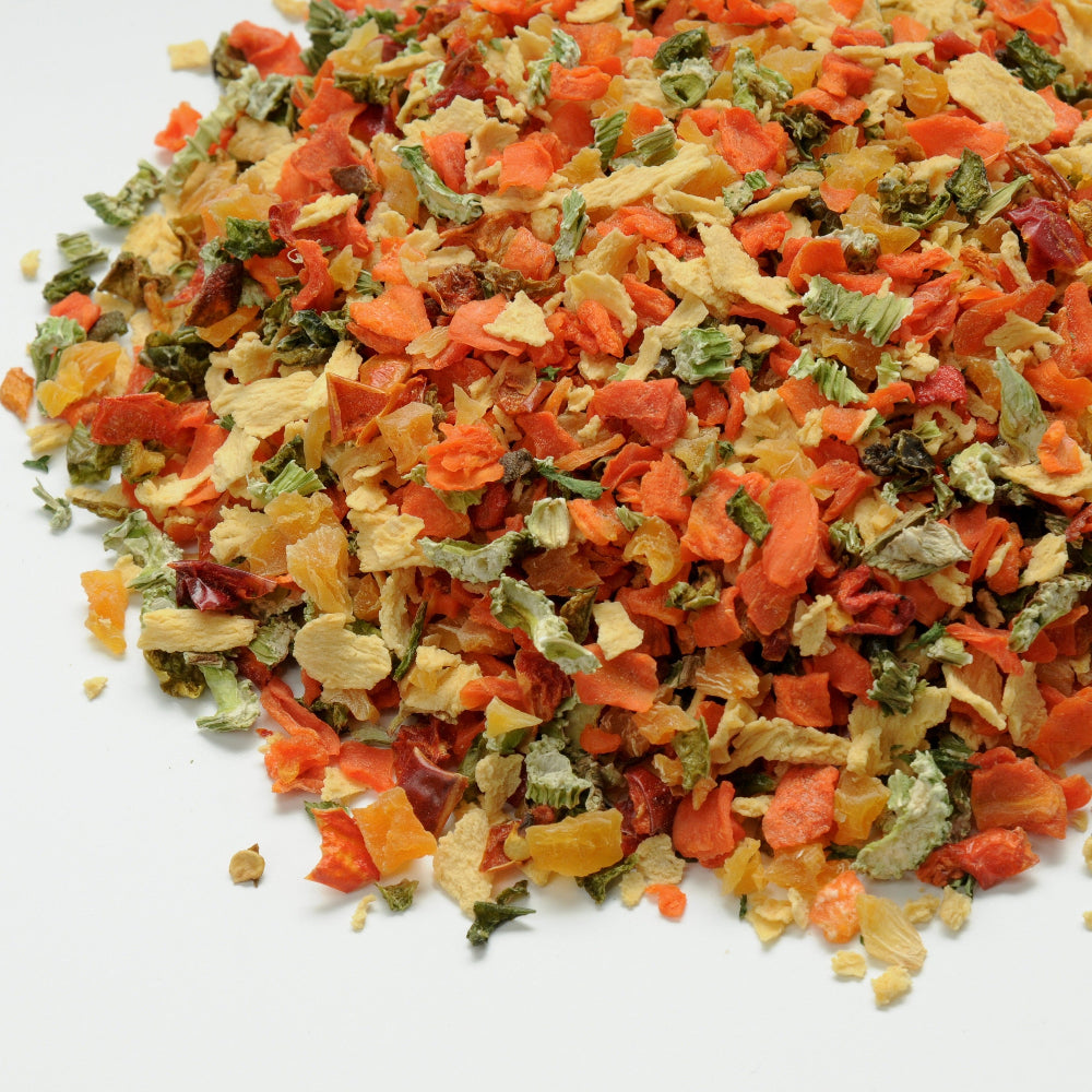 Colorful mix of dried vegetables on a white background
