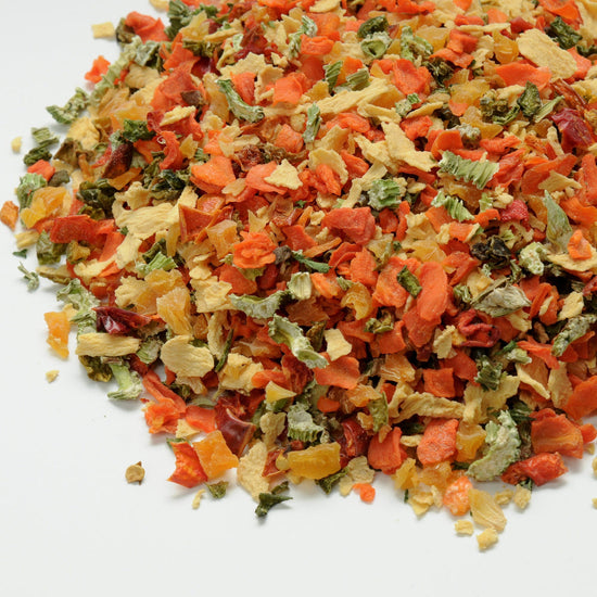 Colorful mix of dried vegetables on a white background