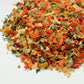 Colorful mix of dried vegetables on a white background